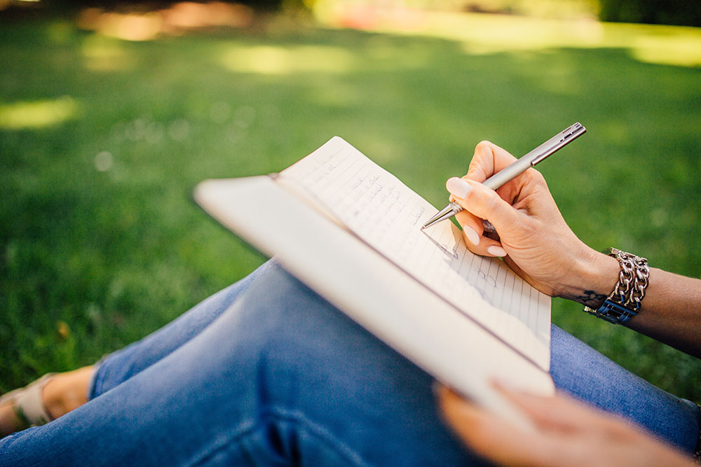 Woman writing in a journal