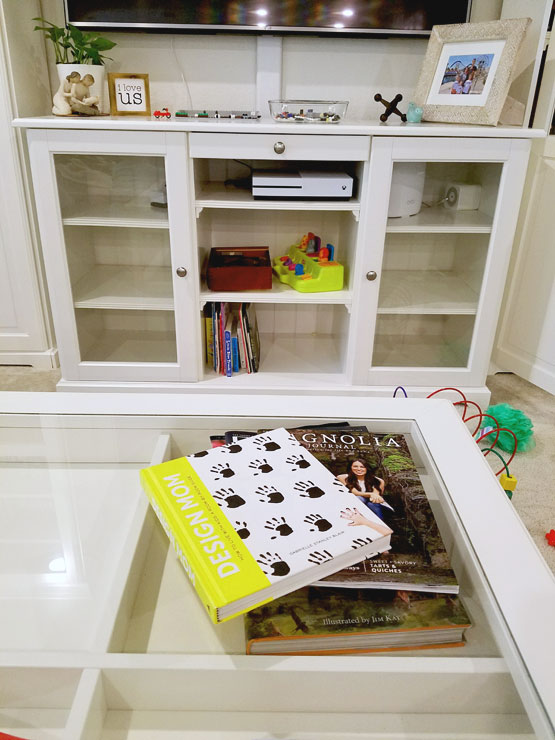 Coffee table with books and magazines.