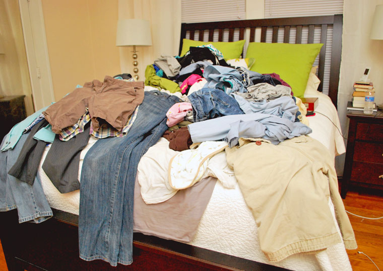 Bed piled high with laundry - Hope for a Messy House