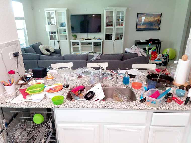 Sink overflowing with dishes in a messy kitchen - Hope for Moms with a Messy Home