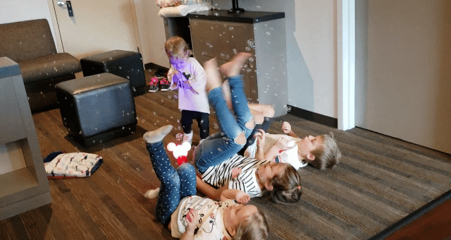 Animated gif of kids wildly kicking bubbles.