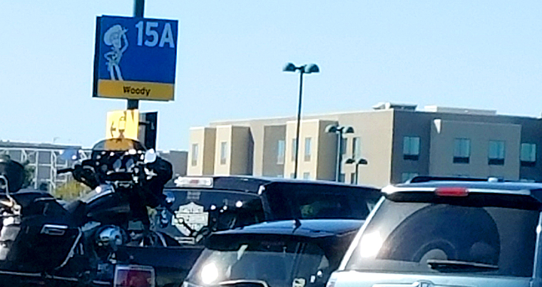 Disneyland parking lot filled with cars at location Woody 15 A.