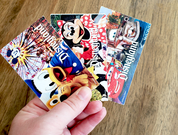 Disney tickets fanned out. Disneyland tip: take photos of the BACK of your ticket in case you lose it!