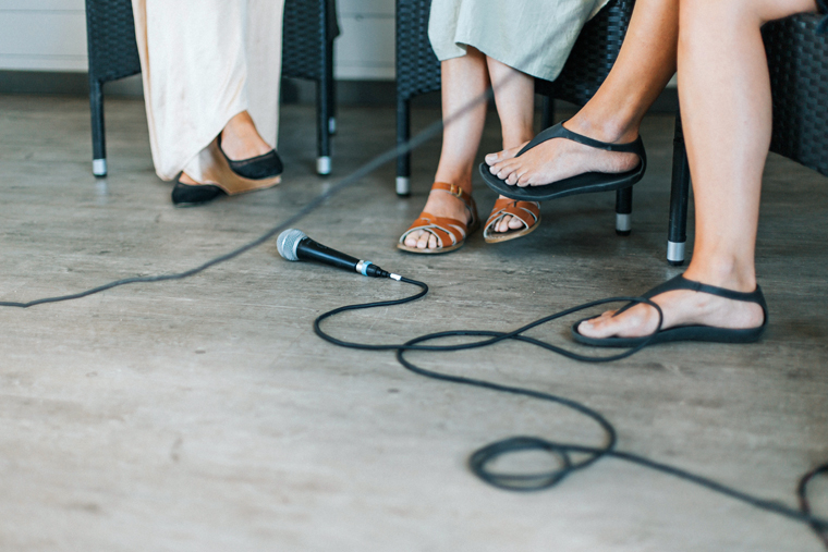 Women's feet with a microphone.