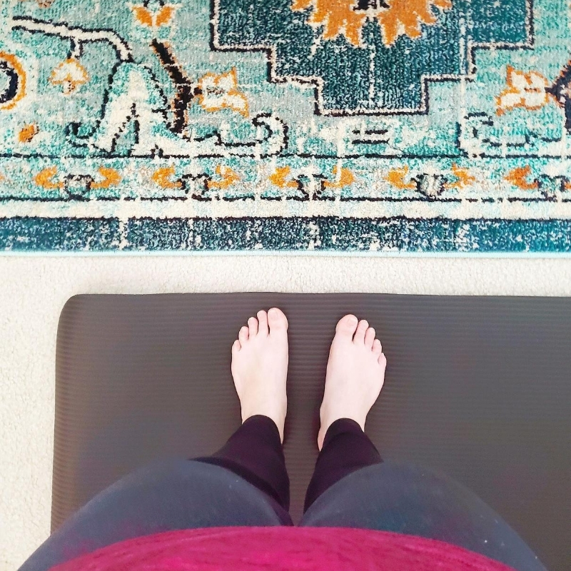 Mom taking a break from her kids to do yoga