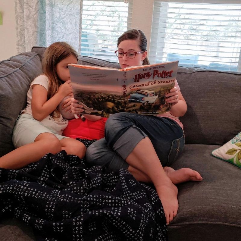 Mom reading to her daughter