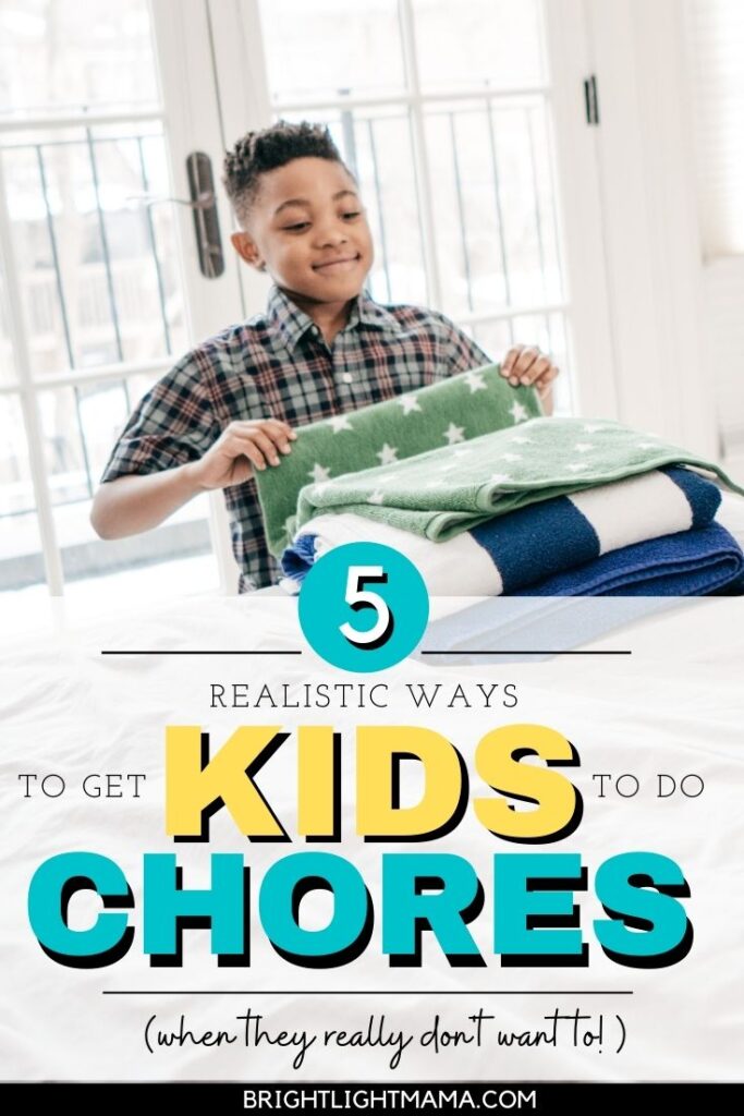 Boy folding laundry with the text 5 ways to get your kids to do chores when they really don't want to